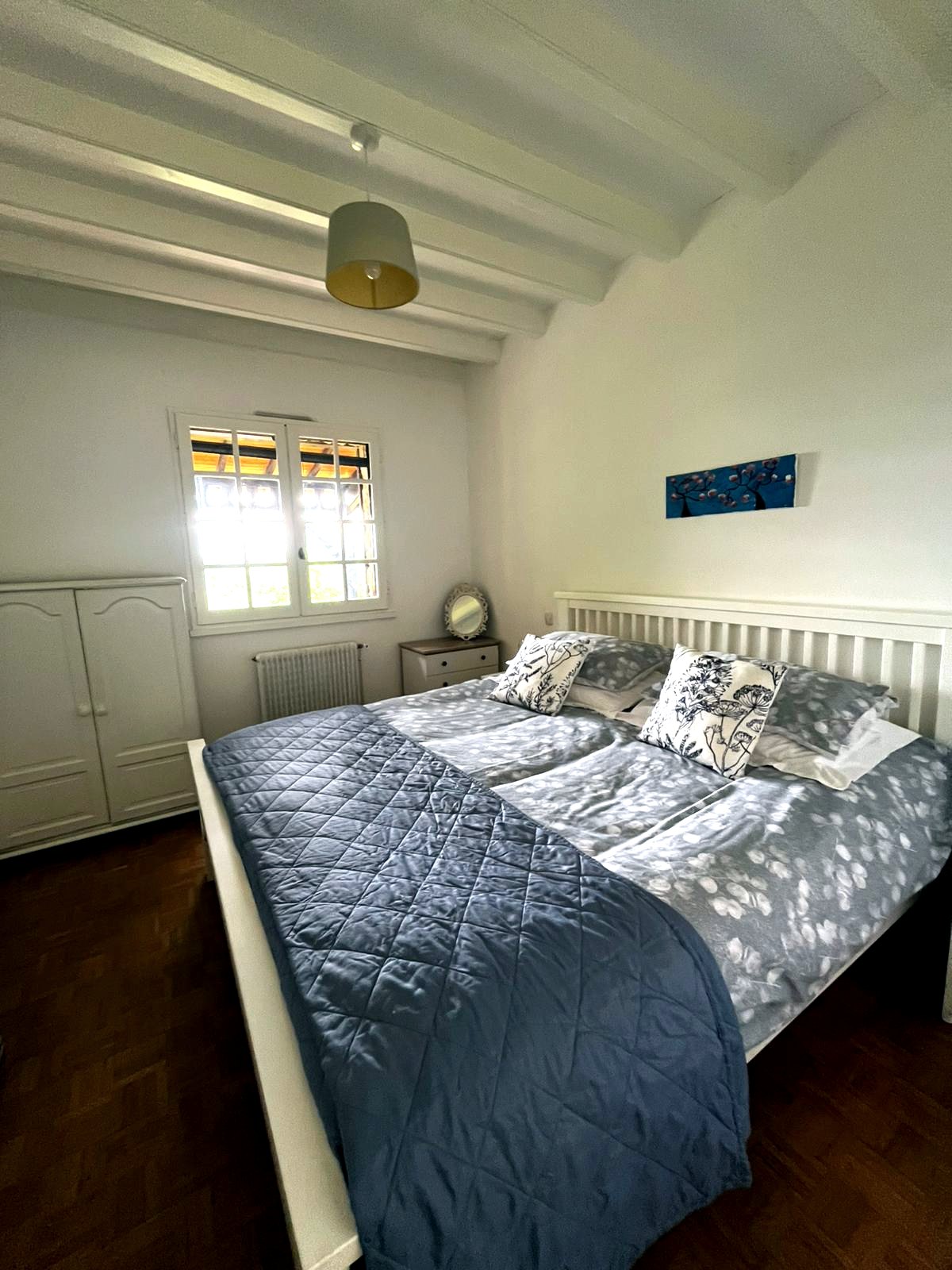 Master bedroom with super king size bed and grey bedding
